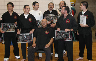 Chris with his teacher, James Ibrao and other black belts